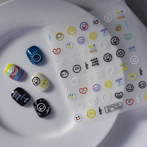 5D relief nail stickers with colorful smiley faces and hearts on white tray