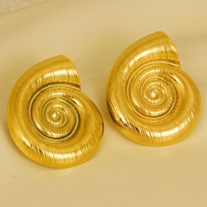 Detailed macro view of gold spiral conch stud earrings featuring a brushed metal texture