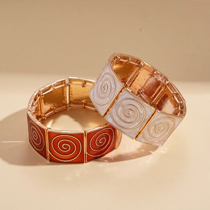 Vintage geometric enamel stretch bracelets with gold-tone metal and spiral textured patterns