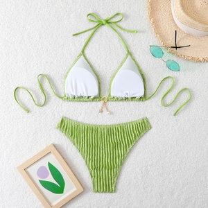 Detail of green bikini with pleated fabric texture and star pearl charms decoration
