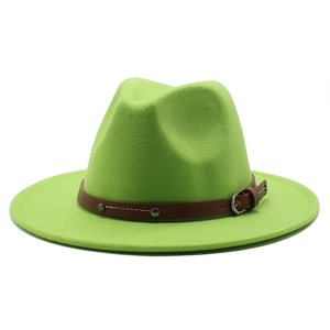 Detail of bright green fedora hat featuring brown leather band with silver buckle