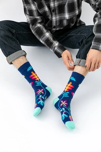 Detail of dark blue floral crew socks with mint green contrast heel and toe