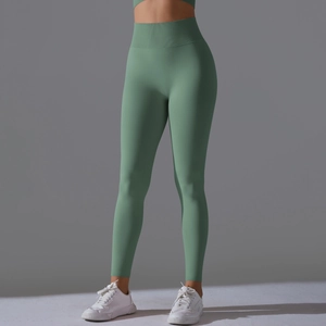 Detail view of high-waist bean green yoga leggings with supportive ribbed waistband
