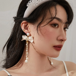 Elegant bowknot tassel earrings with faux pearls and long silver needle dangles