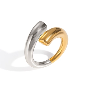 Macro shot of two-tone gold and silver bypass ring with polished mirror finish