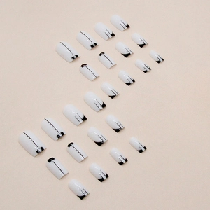 Square black and white press-on nails with minimalist glitter lines and rhinestones