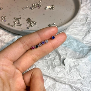 Set of titanium steel heart stud earrings featuring colorful zircon heart gemstones
