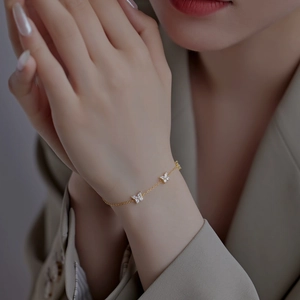 S925 sterling silver gold butterfly bracelet with white zircon pendants on female wrist
