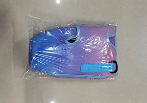 Detail view of water bottle pouch with purple-blue gradient and turquoise strap in packaging