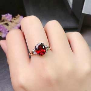 Elegant minimalist garnet ring for women with red oval gemstone and silver band