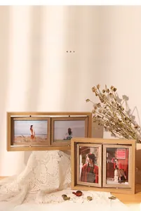Detail of a rotating double-sided wooden photo frame with natural texture for desk display