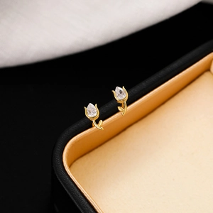 Detail view of 925 silver tulip earrings with water drop zircon in a black jewelry box