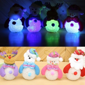 Detailed view of LED Christmas figurines with glowing snowman and reindeer designs