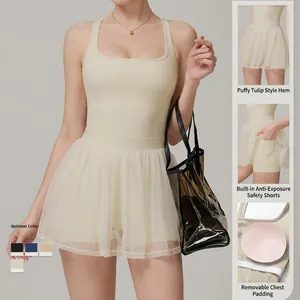 Cream 2-in-1 mesh tennis dress with built-in shorts, pockets, and removable pads