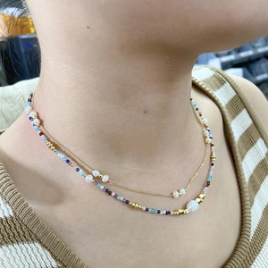 Bohemian double-layered necklace featuring natural amazonite beads and white pearls