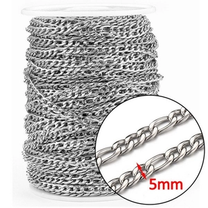 Detailed view of 5mm silver Figaro stainless steel chain links with macro closeup