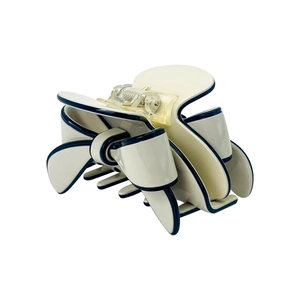 French style cream bow hair claw clip with elegant black outlines and resin finish