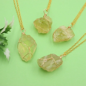 Natural yellow crystal stone pendant with gold wire wrapping on a delicate chain