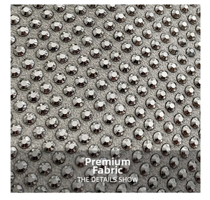 Macro view of high-density silver rhinestone arrangement on premium grey fabric texture