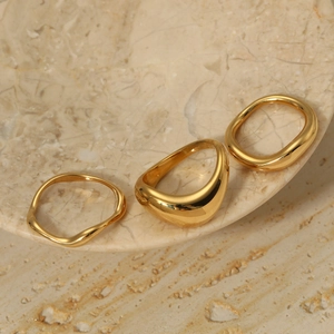 Three-piece set of minimalist irregular 316 stainless steel rings in polished gold finish