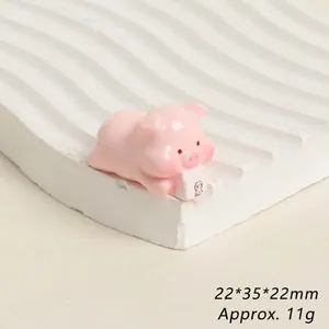 Macro shot of cute pink resin pig figurine with 22x35x22mm dimensions and 11g weight