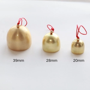 Three golden brass Christmas bells with red cords in 39mm, 28mm and 20mm sizes