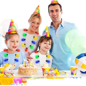 Family wearing glowing Christmas light bulb necklaces with multi-color 9LED bulbs