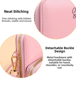 Detail showing fine stitching and gold hardware on a pink leather crossbody bag
