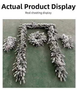 Detail view of 4-piece flocked snowy Christmas wreath and garland set with realistic pine needles