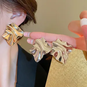 Gold plated irregular pleated metal square stud earrings for a trendy commuter look