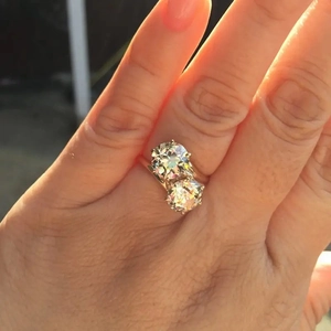 Detail of Toi et Moi double diamond engagement ring in six-prong silver setting