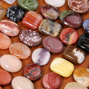 Polished natural stones in diverse colors and shapes for DIY jewelry making and crafts
