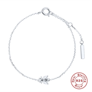Delicate S925 sterling silver chain bracelet with a crystal bee pendant on white backdrop