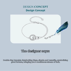 Close-up of interlocking silver rings bracelet with heart charm and extension chain