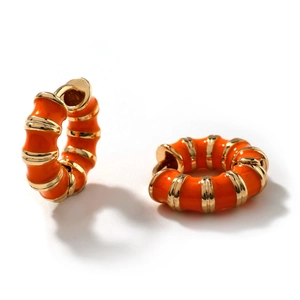 Retro hoop earrings with orange enamel and gold metal stripes for a vibrant luxury look