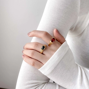 Vintage gold-plated rings with rectangular ruby and black onyx stones on ribbed bands