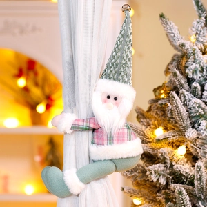 Detailed view of plush Christmas gnome curtain tieback on a window in warm home setting