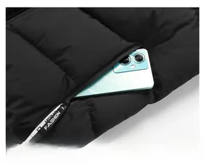 Close-up of quilted vest side pocket with a fashion strap and phone storage detail