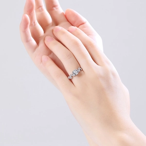 Elegant S925 silver moissanite ring with leaf-shaped diamond wrap on hand