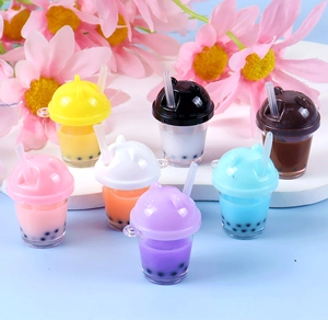 Group of colorful miniature pearl milk tea cup keychains with cute bear ear lids