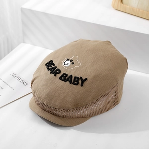 Detail of baby bear embroidery and breathable mesh panels on a brown sun hat