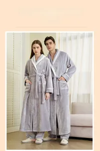Detailed view of thick grey flannel robes with white contrast piping and waist tie