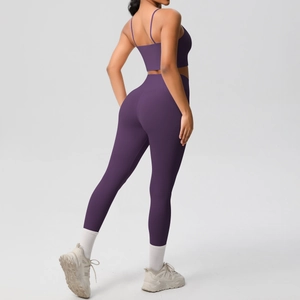 Side view of purple two-piece yoga set with high-waist leggings and sports bra