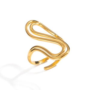 Detailed view of the wavy abstract golden ring with a polished minimalist open design