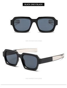 Detail of square black sunglasses featuring silver metal accents on the temples