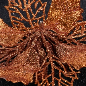 Macro shot of bronze glitter texture and metallic finish on large Christmas flower petal