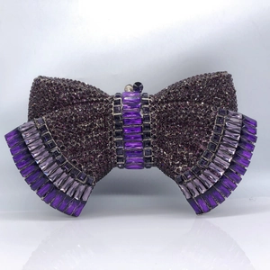 Sparkling purple bow-shaped rhinestone clutch bag with gradient crystal embellishments