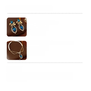 Detail view of vintage pearl necklace and blue teardrop earrings with dimensions