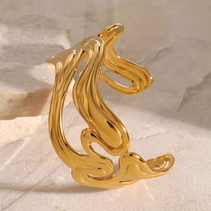 Polished 18k gold plated stainless steel cuff with liquid metal ripple design on stone