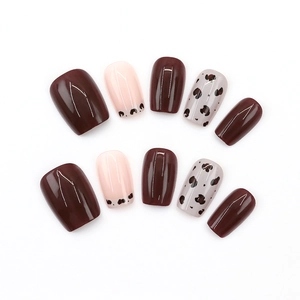 Elegant square press-on nails set featuring deep red and leopard print glitter star designs